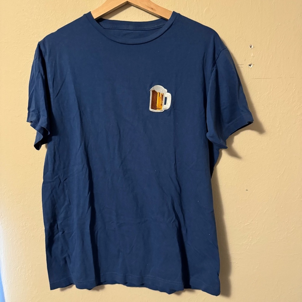 Trash Nouveau Beer patch on dark blue tshirt. Size Medium